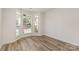 Cozy living room with modern floors and a bright bay window at 1615 Jekyll Ln, Waxhaw, NC 28173