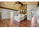 Cozy bedroom with reclaimed wood accent wall, plank ceiling, and hardwood floors at 19528 Mary Ardrey Cir, Cornelius, NC 28031