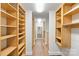 Custom walk-in closet with wooden shelves and ample storage space at 19528 Mary Ardrey Cir, Cornelius, NC 28031