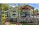 Spacious deck with outdoor seating and fireplace, great for relaxing and enjoying the scenic views at 19528 Mary Ardrey Cir, Cornelius, NC 28031