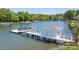Picturesque dock with a boat lift and covered area, providing direct access to the serene lake waters at 19528 Mary Ardrey Cir, Cornelius, NC 28031