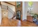 Inviting foyer with hardwood floors, staircase, and plenty of natural light, a warm welcome to guests at 19528 Mary Ardrey Cir, Cornelius, NC 28031