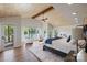 Spacious main bedroom features a vaulted wood ceiling, lake views, and access to a private balcony at 19528 Mary Ardrey Cir, Cornelius, NC 28031