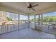 Inviting screened porch with outdoor kitchen and lake views, perfect for entertaining at 19528 Mary Ardrey Cir, Cornelius, NC 28031