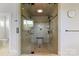 Glass enclosed shower with tile, shower seat and overhead lighting at 19528 Mary Ardrey Cir, Cornelius, NC 28031