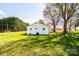 Backyard view showing the home's pristine exterior and well-kept lawn at 1993 Moss Farm Rd, Hickory, NC 28602