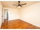 Bright bedroom featuring hardwood floors, ceiling fan, and natural light at 1993 Moss Farm Rd, Hickory, NC 28602