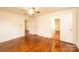 Bedroom featuring hardwood floors, view to hallway, and ceiling fan at 1993 Moss Farm Rd, Hickory, NC 28602