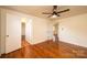 Hardwood floors, ceiling fan, and natural light enhance this bedroom at 1993 Moss Farm Rd, Hickory, NC 28602