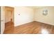 Bedroom featuring vinyl wood floors, neutral paint, and a view to the hallway at 1993 Moss Farm Rd, Hickory, NC 28602