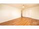 Bedroom features vinyl wood floors, a ceiling fan, and a closet at 1993 Moss Farm Rd, Hickory, NC 28602