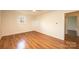Bedroom featuring vinyl wood floors, ceiling fan, and view to hallway at 1993 Moss Farm Rd, Hickory, NC 28602