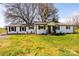 View of the well-kept lawn and landscaping in front of this inviting single-story home at 1993 Moss Farm Rd, Hickory, NC 28602