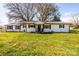 Charming single-story home featuring a well-manicured lawn and freshly painted exterior at 1993 Moss Farm Rd, Hickory, NC 28602
