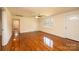 Inviting living room with hardwood floors, a ceiling fan, and a bright entrance at 1993 Moss Farm Rd, Hickory, NC 28602