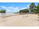 Idyllic beach scene featuring lounge chairs and scenic lake views with a wooden dock at 20637 Island Forest Dr, Cornelius, NC 28031