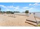 Picturesque beach with inviting chairs, clear lake views, and a long pier at 20637 Island Forest Dr, Cornelius, NC 28031