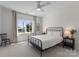 Bright bedroom features neutral colors, large window and black metal bed frame at 20637 Island Forest Dr, Cornelius, NC 28031