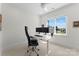 Home office featuring a stand-up desk, ergonomic chair, and large windows for great light and a view at 20637 Island Forest Dr, Cornelius, NC 28031