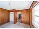 Spacious bedroom featuring paneled walls, an open closet and access to other rooms at 208 Columbia Ave, Rock Hill, SC 29730