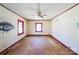 A sun-drenched room featuring two windows and a ceiling fan at 208 Columbia Ave, Rock Hill, SC 29730