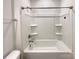 Bathroom featuring a white tub/shower combo with built in shelves and chrome fixtures at 2085 Saddlebred Dr, Iron Station, NC 28080