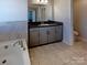 Bright bathroom featuring a large tub, granite vanity top and tile flooring at 2085 Saddlebred Dr, Iron Station, NC 28080