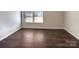 Bedroom with hardwood floors and natural light from window at 2085 Saddlebred Dr, Iron Station, NC 28080