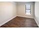 Bedroom with hardwood floors, neutral walls, and natural light from window at 2085 Saddlebred Dr, Iron Station, NC 28080