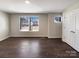 Bright bedroom with hardwood floors, natural light and double door closet at 2085 Saddlebred Dr, Iron Station, NC 28080