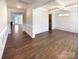 Bright dining area with dark wood floors, coffered ceilings, and wainscoting adds an elegant touch at 2085 Saddlebred Dr, Iron Station, NC 28080