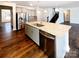 Kitchen island with granite countertop, stainless steel sink and dishwasher in an open concept area at 2085 Saddlebred Dr, Iron Station, NC 28080