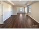 Spacious living room with tray ceiling, hardwood floors and bright natural light at 2085 Saddlebred Dr, Iron Station, NC 28080
