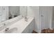 Bright bathroom with double sink vanity, large mirror, and a combined shower and tub at 2115 Genesis Dr, Monroe, NC 28110