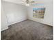 Bright bedroom with carpet, ceiling fan, and window providing natural light at 2115 Genesis Dr, Monroe, NC 28110