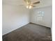 Bright bedroom with carpet, ceiling fan, and window providing natural light at 2115 Genesis Dr, Monroe, NC 28110