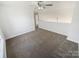 Bright loft area with neutral carpet and ceiling fan, creating a versatile space at 2115 Genesis Dr, Monroe, NC 28110