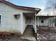 Exterior of a home with an inviting covered porch and a walkway leading to the front door at 2124 Shoal Rd, Lincolnton, NC 28092