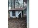 Exterior view of a dilapidated shed with a rusty roof, set amidst fallen leaves at 2124 Shoal Rd, Lincolnton, NC 28092