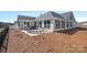 Backyard view of covered porch at 218 Alenda Lux Cir, Mooresville, NC 28115