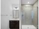 Modern bathroom featuring a glass-enclosed shower and stylish vanity with dark wood cabinets at 218 Alenda Lux Cir, Mooresville, NC 28115