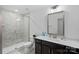 Well-lit bathroom showcasing a walk-in shower and vanity with ample counter space at 218 Alenda Lux Cir, Mooresville, NC 28115