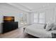 Bright bedroom with French doors, large windows, and a dark wood dresser at 218 Alenda Lux Cir, Mooresville, NC 28115