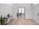 Clean entryway with wood floors, plants, and an office space view at 218 Alenda Lux Cir, Mooresville, NC 28115