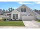 Beautiful two-story home with landscaped lawn and two car garage at 218 Alenda Lux Cir, Mooresville, NC 28115