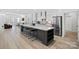 Open kitchen featuring an island with bar seating, stainless steel appliances, and ample counter space at 218 Alenda Lux Cir, Mooresville, NC 28115