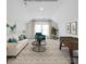 Staged living room with large windows and plenty of seating at 218 Alenda Lux Cir, Mooresville, NC 28115