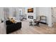 Living room featuring a fireplace, seating arrangement, and view of an open floor plan at 218 Alenda Lux Cir, Mooresville, NC 28115