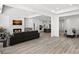 Open-concept living room features a fireplace, seamless flow to the dining area and modern finishes at 218 Alenda Lux Cir, Mooresville, NC 28115