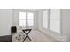 Bright home office featuring large windows and minimalist desk at 218 Alenda Lux Cir, Mooresville, NC 28115